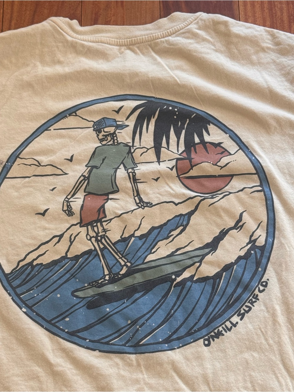 O'Neill Surf Graphic Tee - Tan with Blue & Red Print beach skeleton